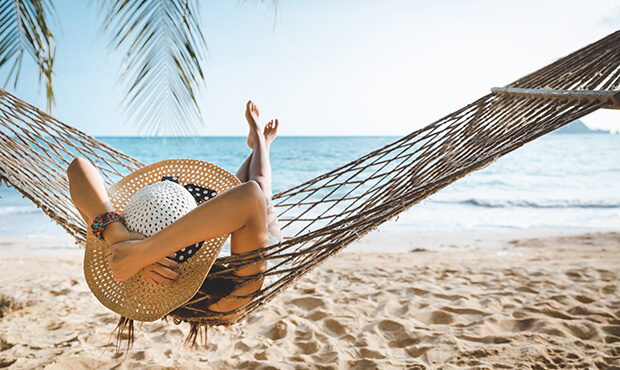 lady in hammock enjoying the beach.