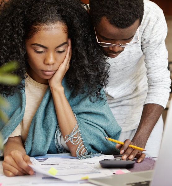 Couple calculating finances.