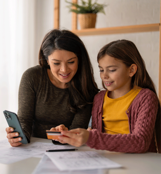 Mom teaching her kid about debit card.