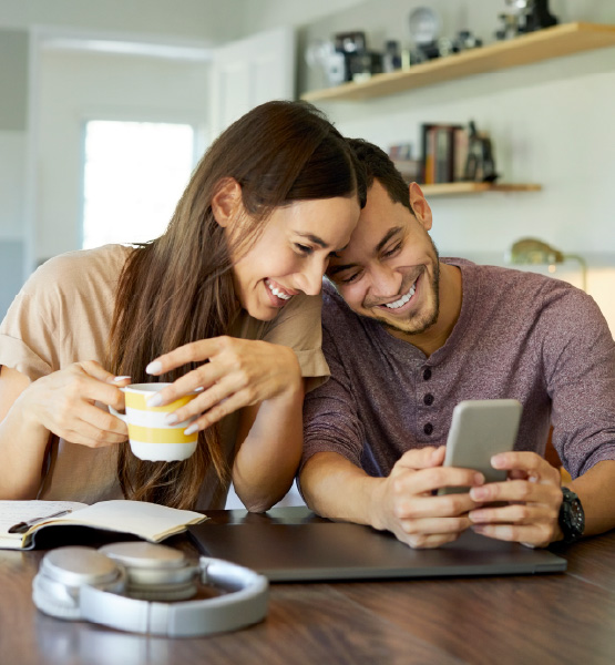 Couple using Capital Credit Union digital
banking mobile app