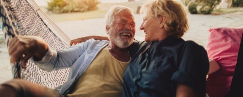 Elder couple sitting together.