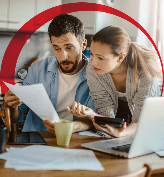 Couple doing calculations and working on a document together