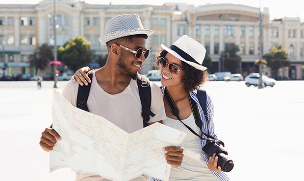 couple looking at map on their dream vacation