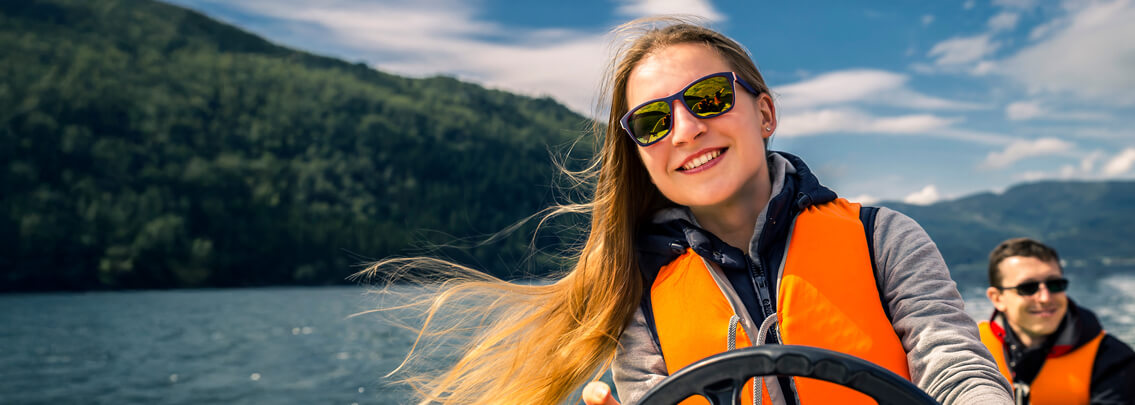 Lady driving boat