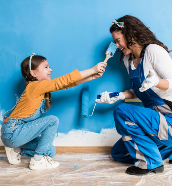 Child brushing paint on her mother
during a home improvement project funded by a home equity loan